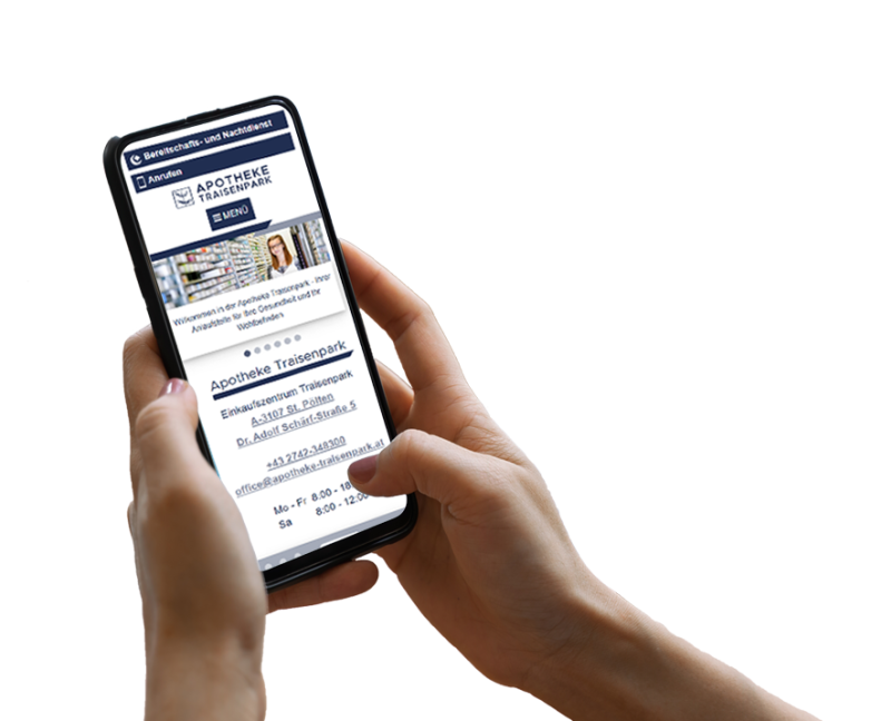 Hand h&auml;lt Smartphone, darauf ist ein Screenshot der Website zu sehen