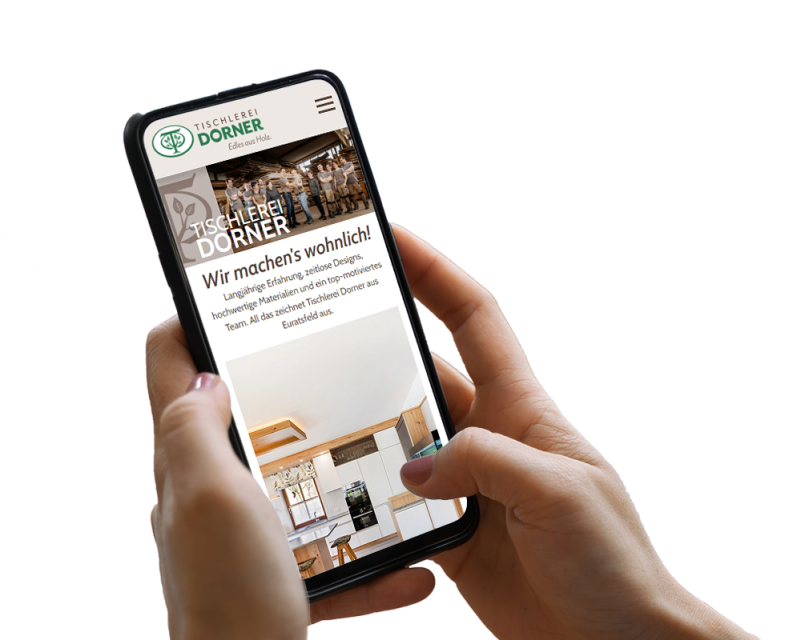 Hand h&auml;lt Smartphone, darauf ist ein Screenshot der Website zu sehen