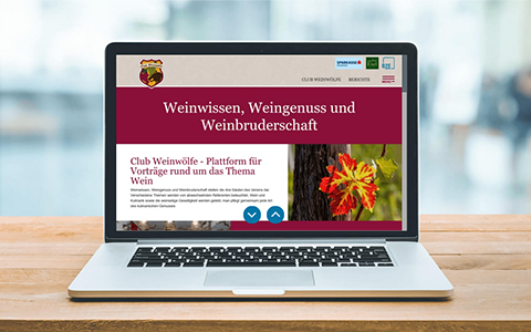 Das Wappen der Weinwölfe: Weintrauben, ein Wolf und Text
